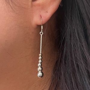 Silver droplet dangling earrings